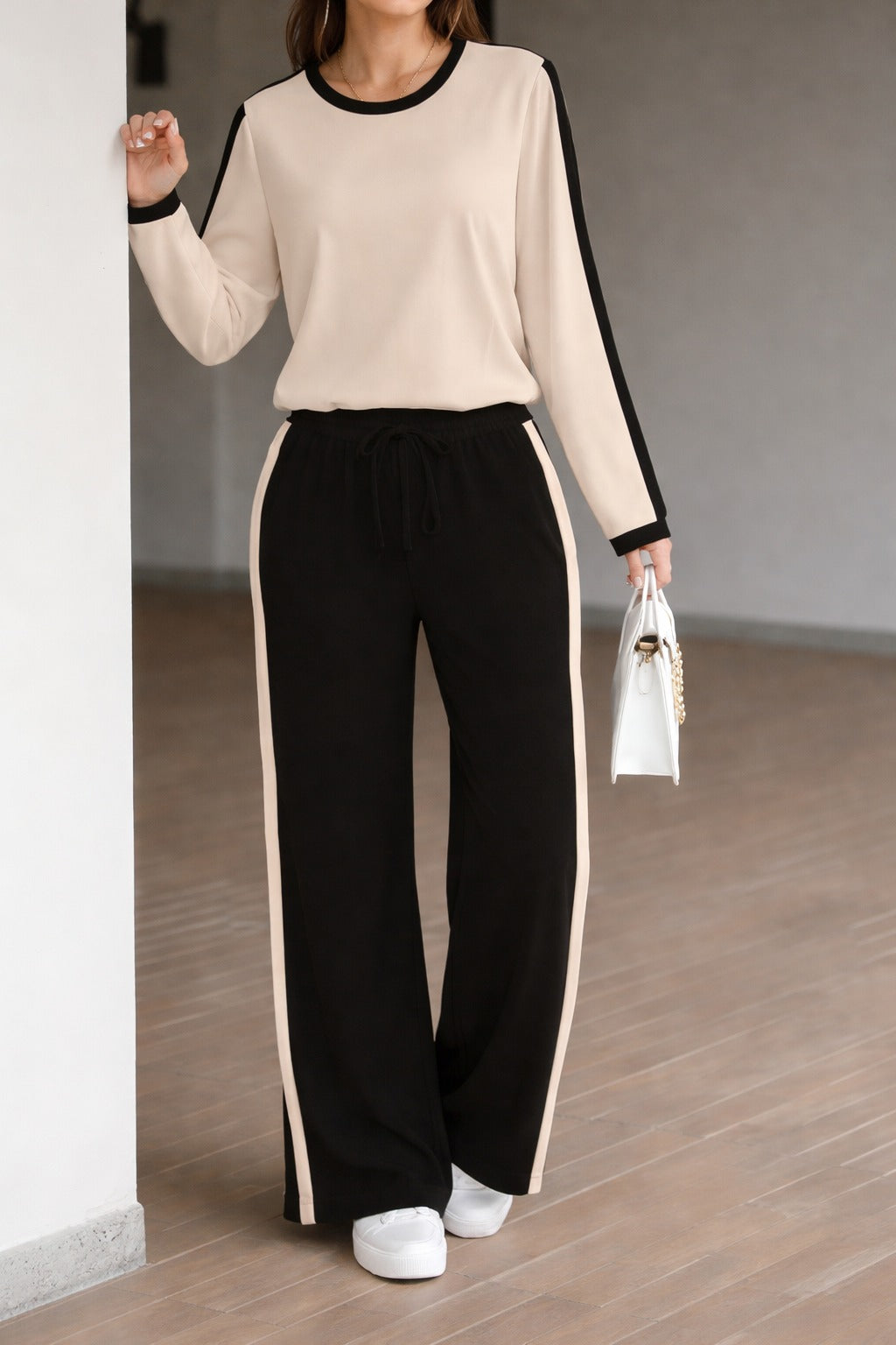 Off white with black pipen full sleeves panel T shirt with black panel trousers For her